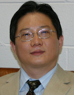 Portrait of Dr. Zhanhai Zhang, MD trained in Beijing and licensed acupuncturist in Illinois.